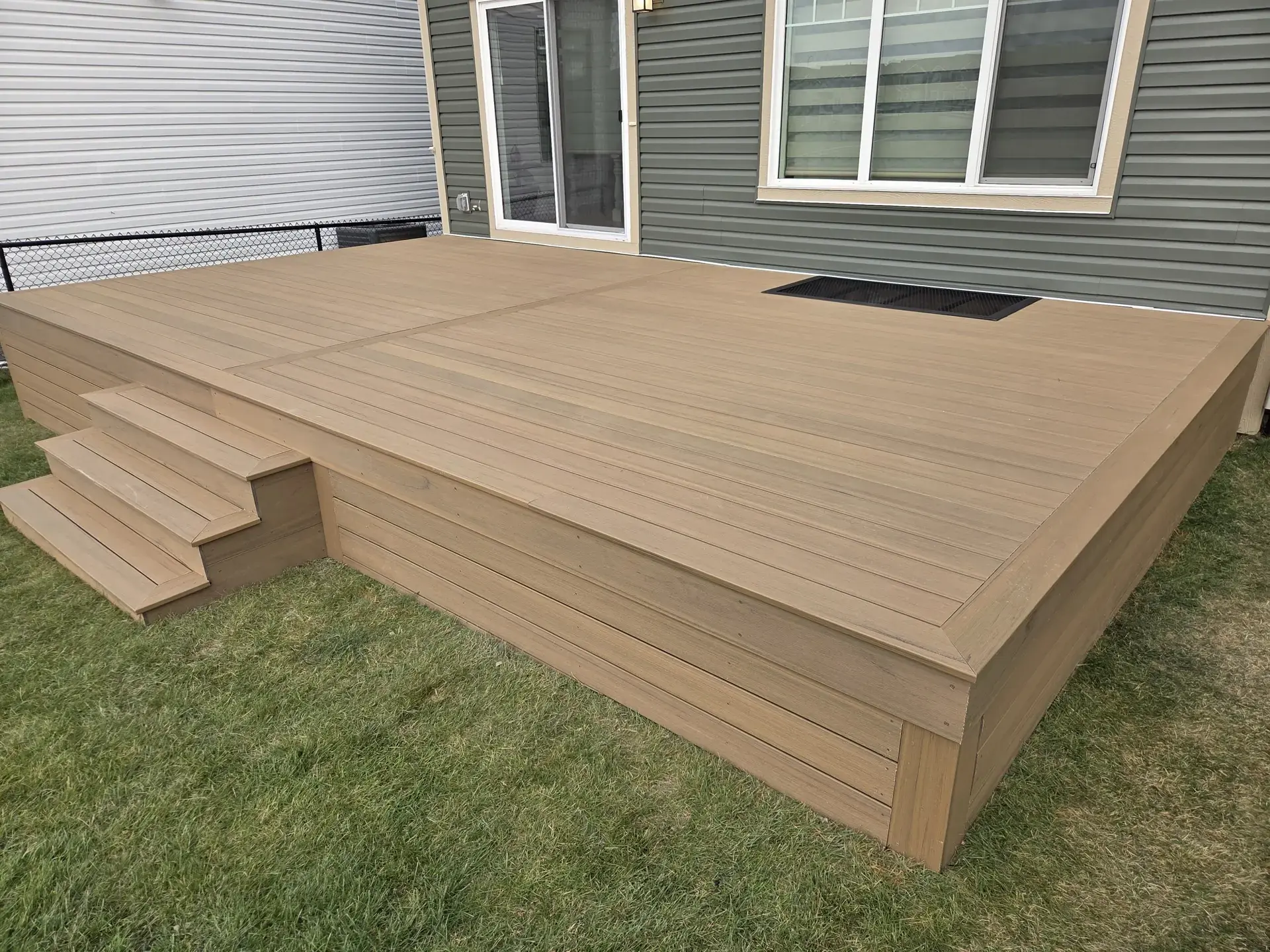 Custom composite deck with hot tub cutout — Serenity Construction Calgary