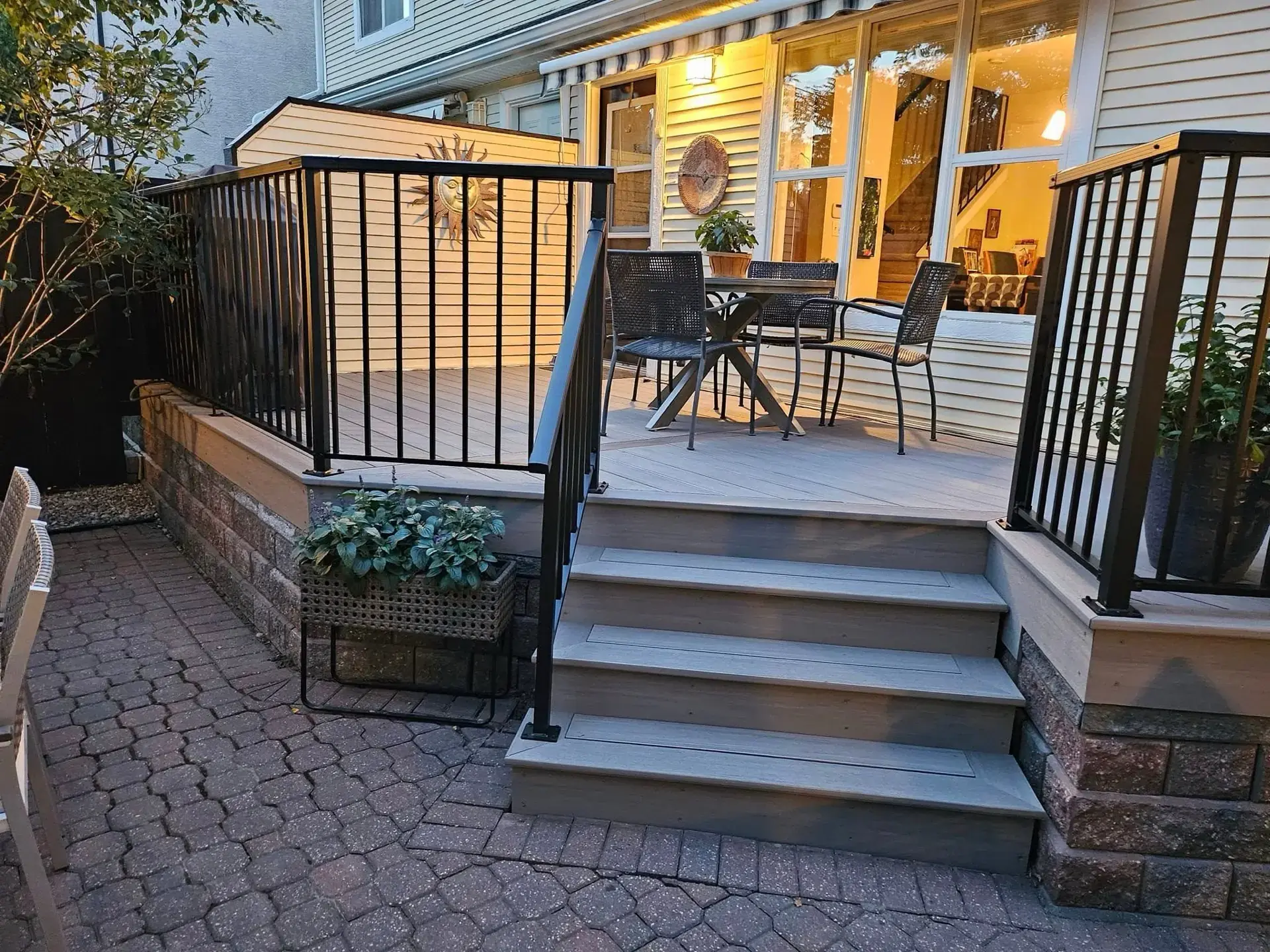 Deck with railing, steps, and evening LED lighting — Calgary