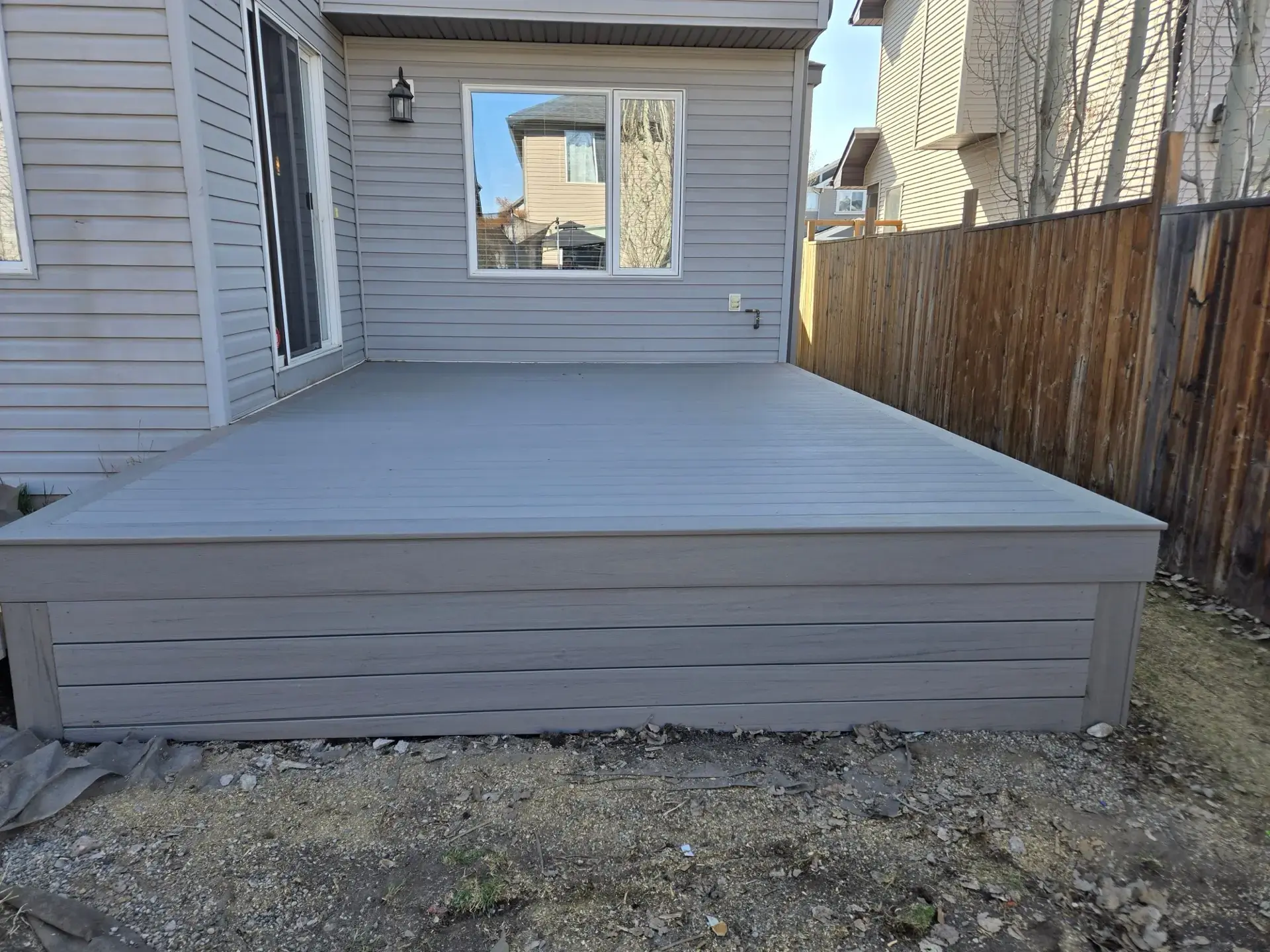 Light Grey Platform Deck — Calgary composite deck by Serenity Construction