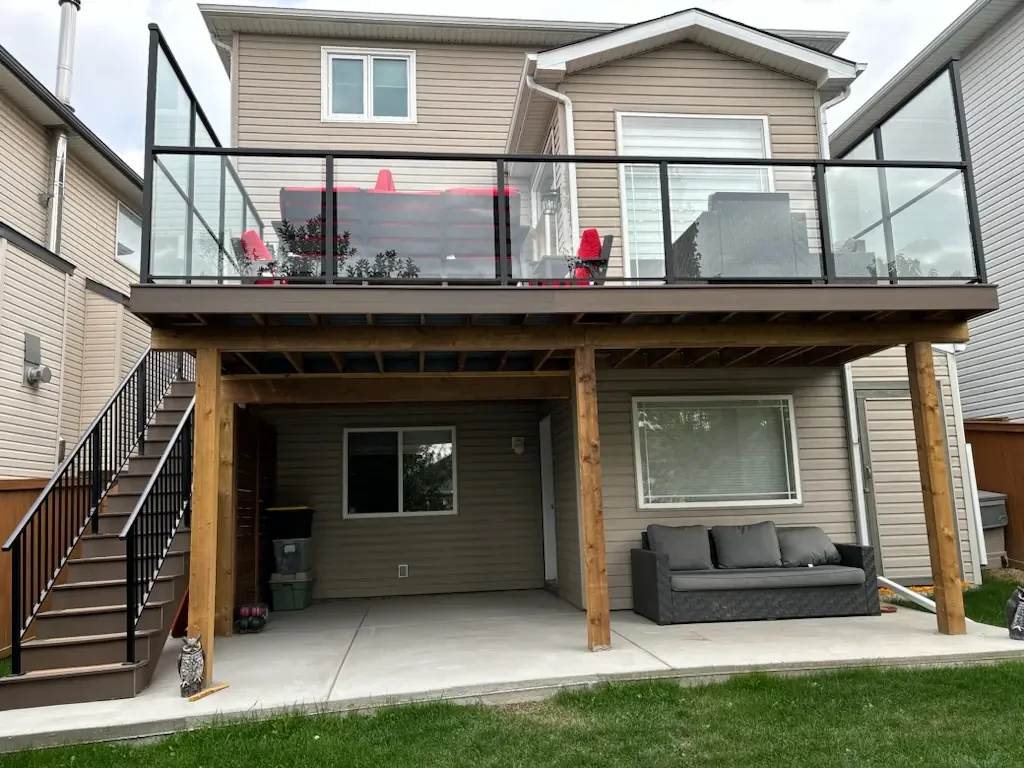 Second floor PVC deck with glass railing — Calgary