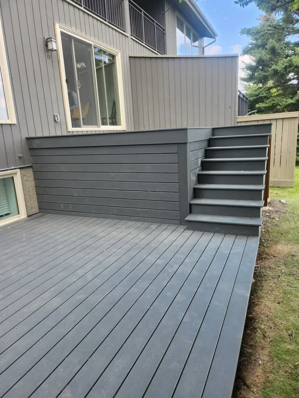 Grey Exterior with Matching Deck — Calgary composite deck by Serenity Construction