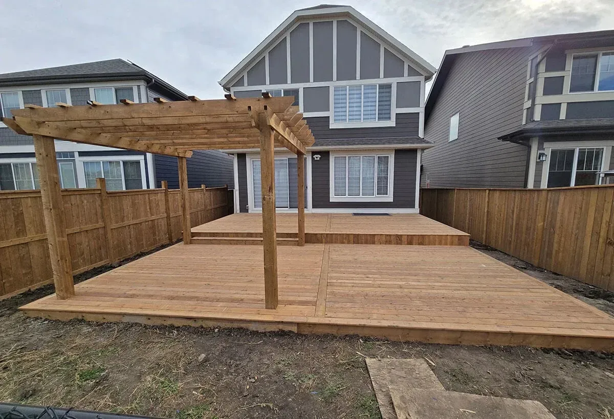 Contractor discussing project details with a homeowner at a pool deck site